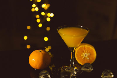 Close-up of orange juice on table