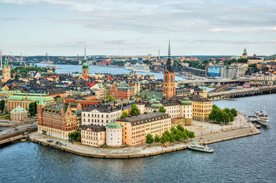 High angle view of river against buildings in city