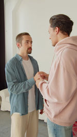 Side view of man using digital tablet in office
