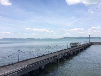 Bridge over sea against sky