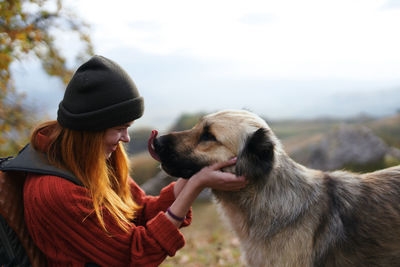 Rear view of woman with dog