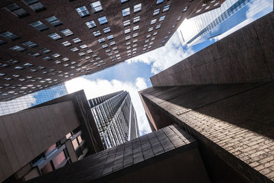 Low angle view of modern buildings against sky