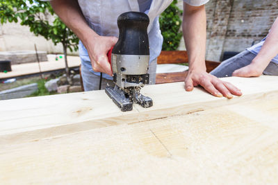 Midsection of man working at construction site