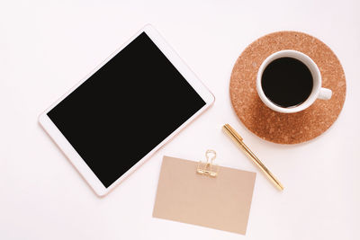 High angle view of coffee cup on table