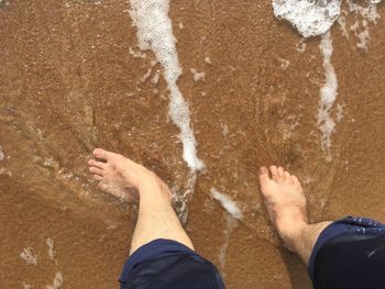 Low section of people on beach