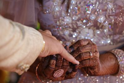 Close-up of hand holding hands