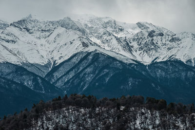 Scenic view of snowcapped mountains against sky