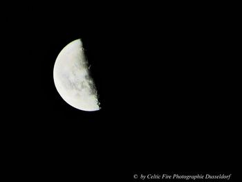 Low angle view of moon against sky at night