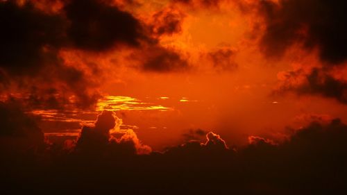 Low angle view of dramatic sky at sunset