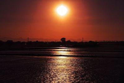 Scenic view of sea at sunset