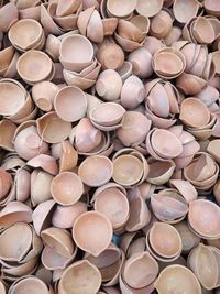 Ceramic diya stacked for sale at market during diwali festival