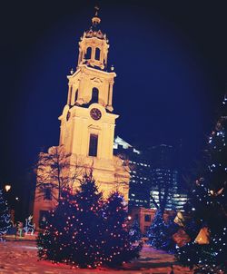 Low angle view of illuminated building at night