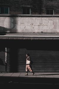 Walker in brixton with old urban background