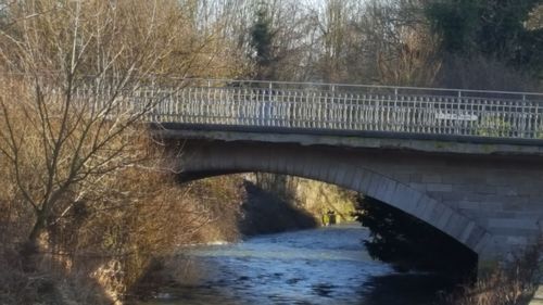 Bridge over river against sky