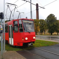 Red car on road against sky