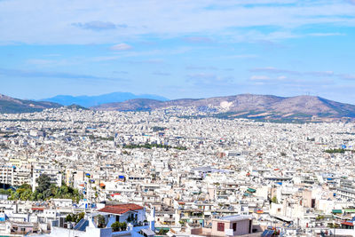 Panoramic view of people on mountain against sky