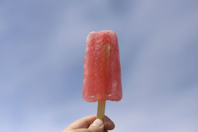 Close-up of hand holding ice cream cone