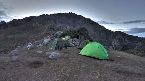 Camping tent on top of mountain against sky