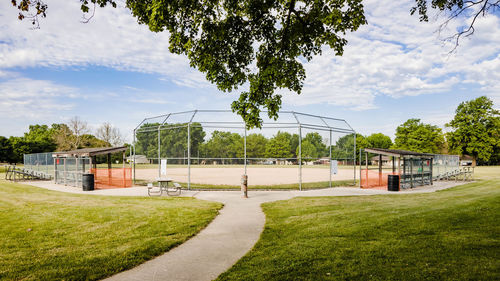 A view of a youth baseball field in a city park