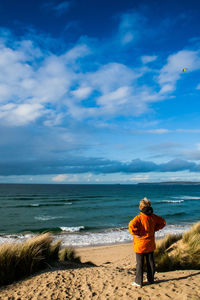 Scenic view of sea against cloudy sky