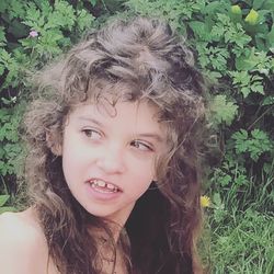 Portrait of smiling girl with plants