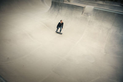 High angle view of man skating at skateboard park