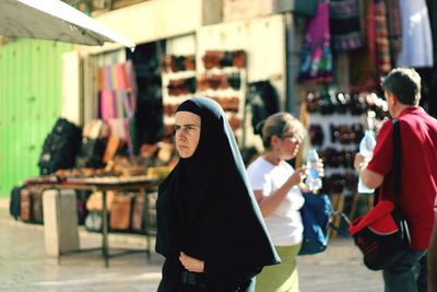 People at market stall
