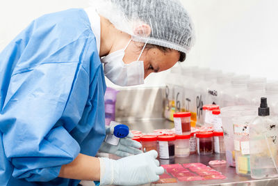 Scientist processing biopsy samples at the pathology laboratory to be embedded in paraffin.