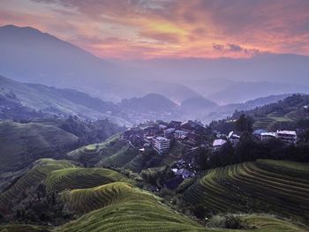 Scenic view of landscape against sky during sunset