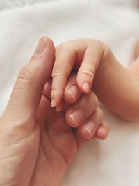 Close-up of hands holding baby feet