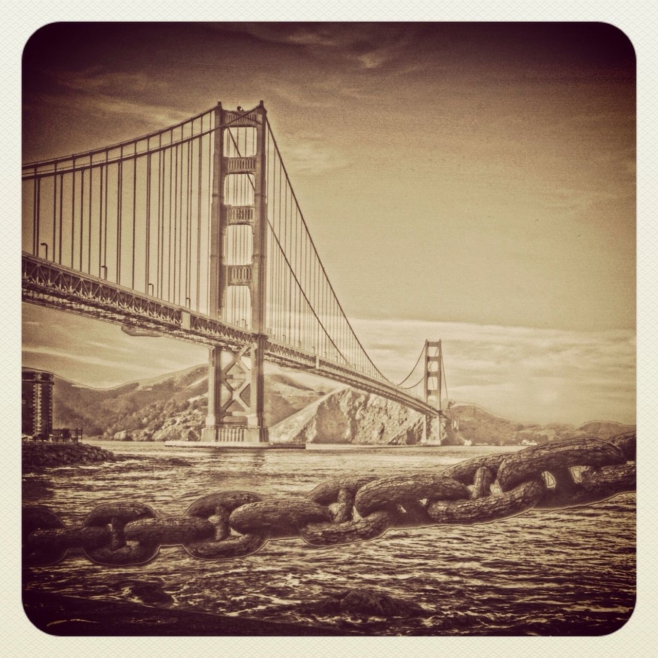 transfer print, connection, water, bridge - man made structure, auto post production filter, sea, beach, built structure, sand, bridge, architecture, engineering, suspension bridge, shore, sky, nature, outdoors, railing, tranquility, river