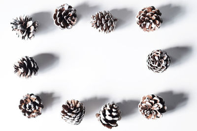 Close-up of decoration over white background
