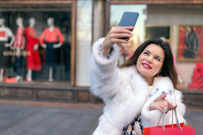 Portrait of woman photographing