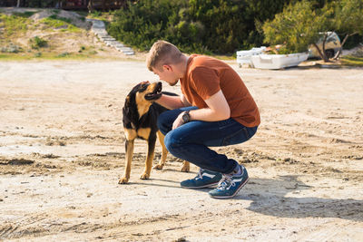 Full length of man with dog