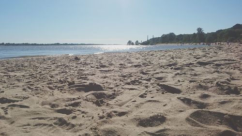 Scenic view of beach against clear sky