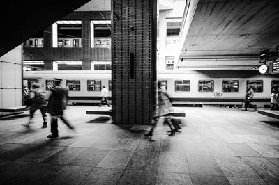 People walking on zebra crossing in city