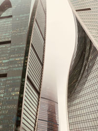 Low angle view of modern buildings against clear sky