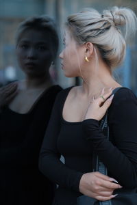 Side view of woman with dog at home