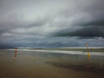 Scenic view of sea against cloudy sky