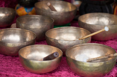 Close-up of rin gongs at market stall