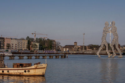 View of built structures against clear blue sky