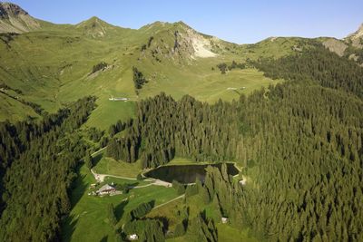 Scenic view of landscape and mountains against sky