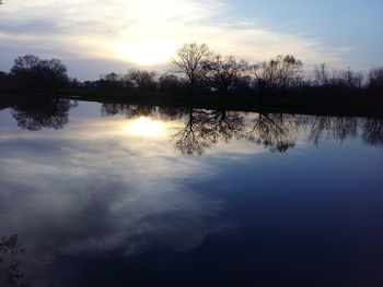 Scenic view of lake against sky during sunset