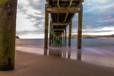 Pier over sea against sky