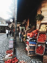 People at market stall in city