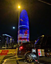 Illuminated modern buildings in city at night