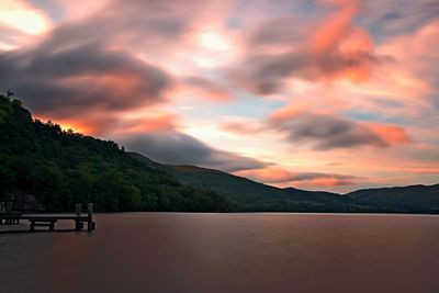 Scenic view of lake against sky during sunset