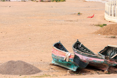 Abandoned boat on sandy beach