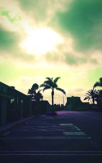 Road against cloudy sky at sunset