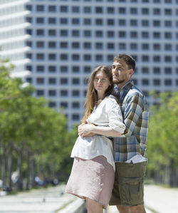 Young couple standing outdoors